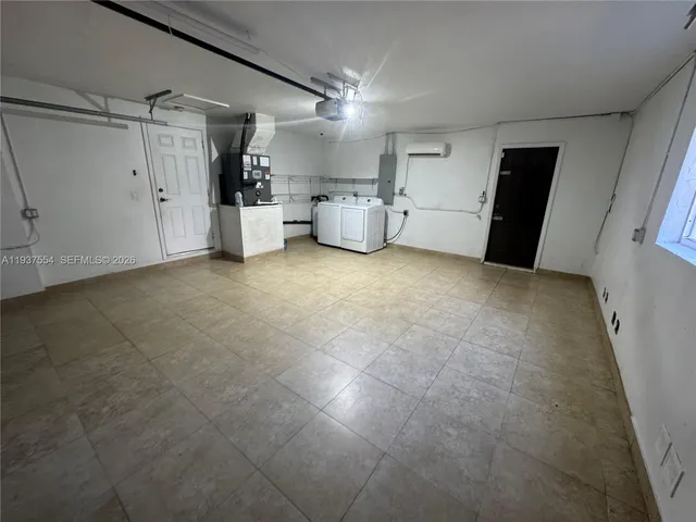 a view of a storage & utility room with a sink