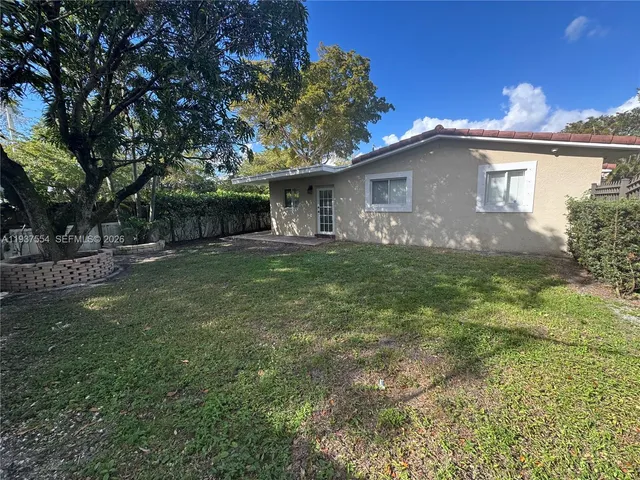 a house view with a garden space