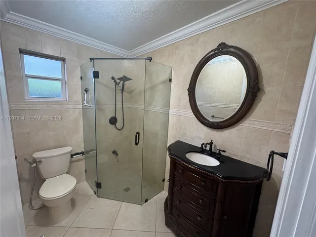 a bathroom with a toilet a sink and a mirror