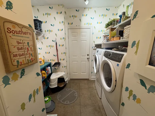 a utility room with dryer and washer
