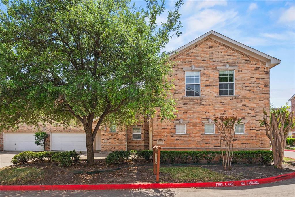706 South Jupiter Road, Unit 1101 Allen, TX 75002 - Photo 2 of 31 a front view of a house with street
