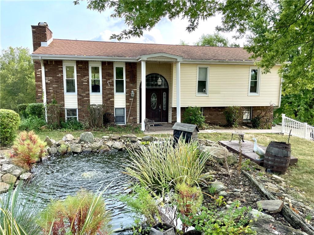 418 Forrest Hill Road Industry, PA 15052 - Photo 1 of 44 a view of a house with swimming pool and porch with furniture