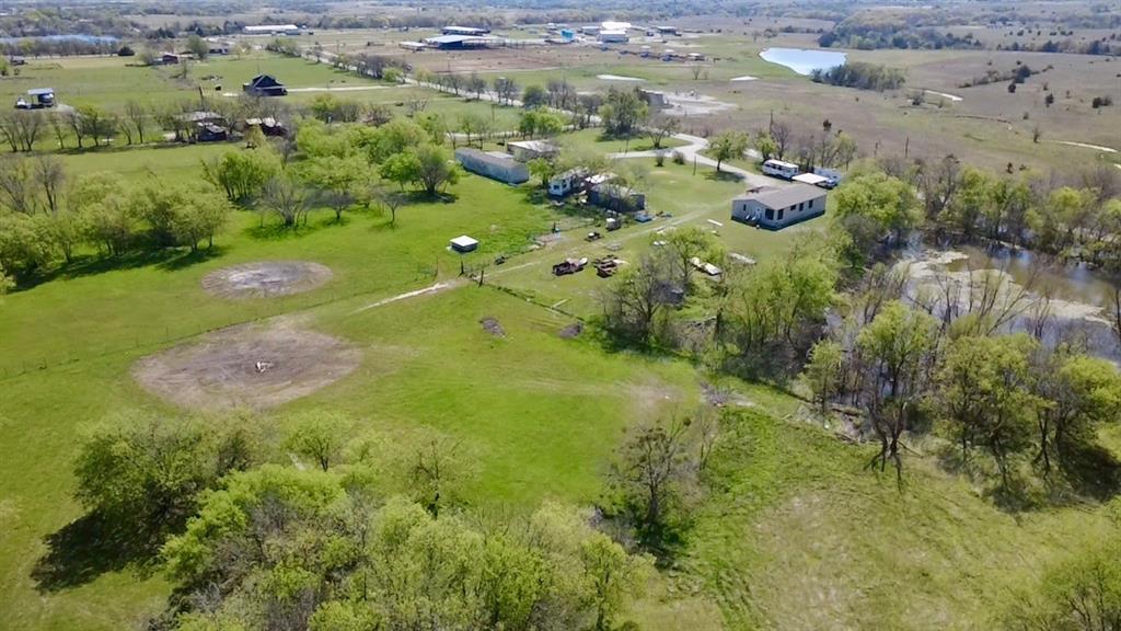 1801 Old Denton Highway Decatur, TX 76234 - Photo 4 of 9 a view of a green yard with large trees