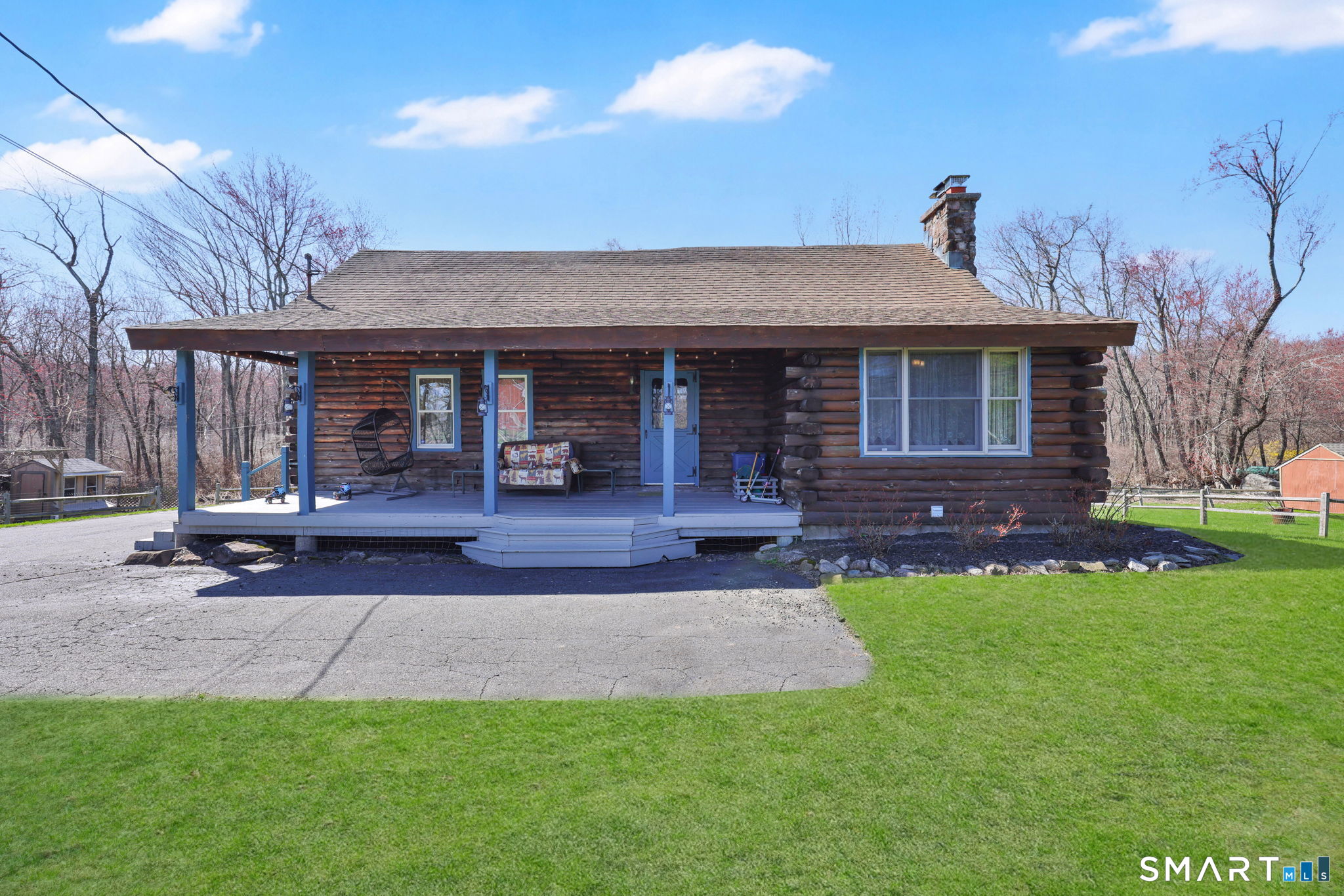 a view of a house with a yard porch and sitting area