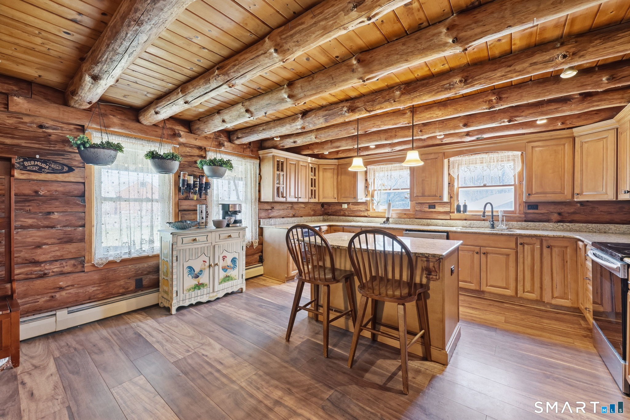 800 Gaylord Mountain Road Hamden, CT 06518 - Photo 13 of 40 a kitchen with granite countertop a wooden table and chairs