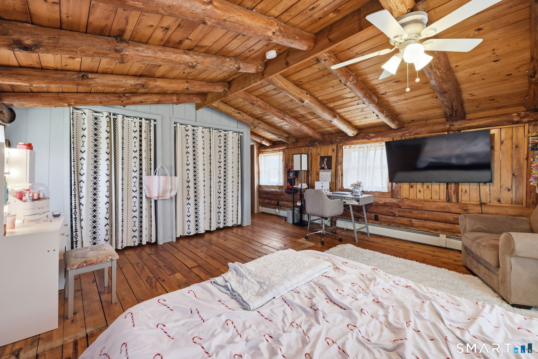 800 Gaylord Mountain Road Hamden, CT 06518 - Photo 30 of 40 a spacious bedroom with a bed a flat screen tv and a chandelier
