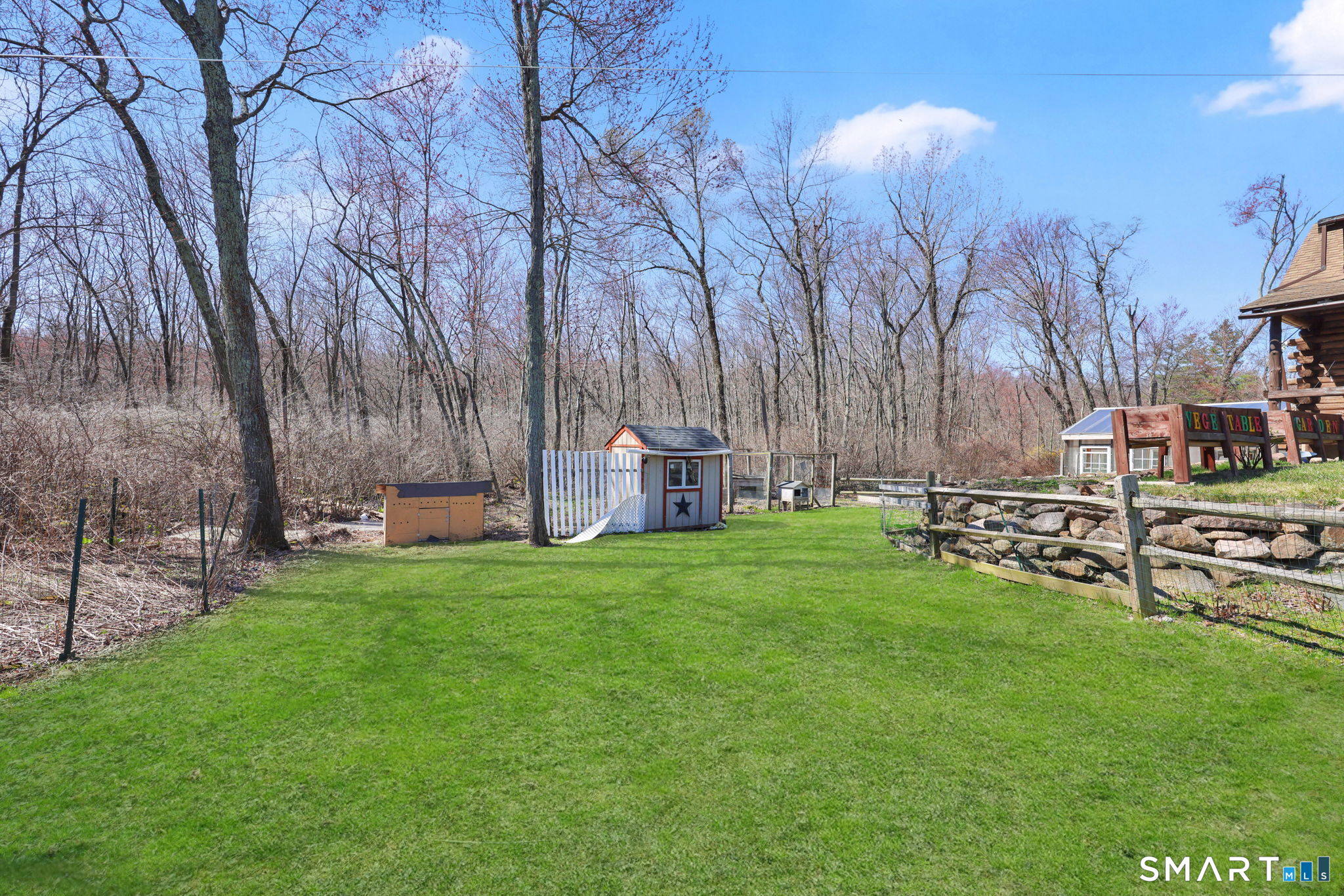 800 Gaylord Mountain Road Hamden, CT 06518 - Photo 7 of 40 a backyard of a house with table and chairs
