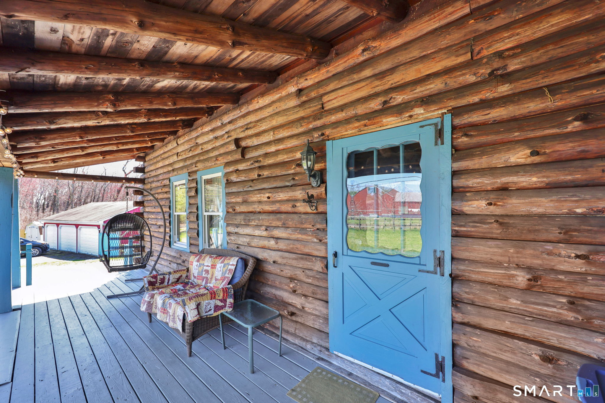 800 Gaylord Mountain Road Hamden, CT 06518 - Photo 10 of 40 a view of a porch with furniture and wooden floor