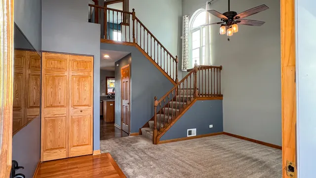 a view of an entryway with wooden floor