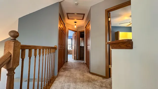 a view of a hallway with windows