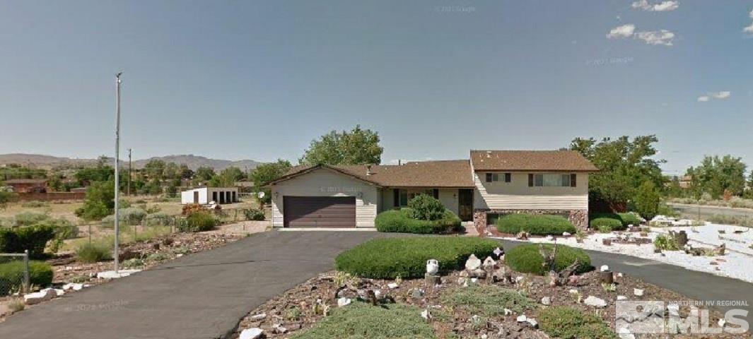10135 Shenandoah Drive Reno, NV 89508 - Photo 1 of 1 a front view of a house with a yard and outdoor seating