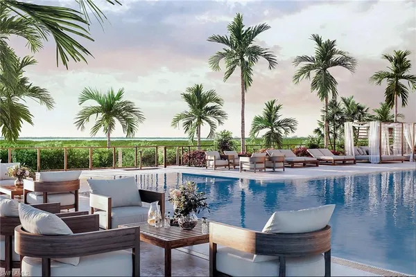 a view of a swimming pool and chairs
