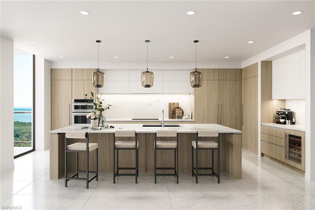 5100 Baybridge Boulevard, Unit 1704 Estero, FL 33928 - Photo 2 of 35 a kitchen that has a table and chairs in it