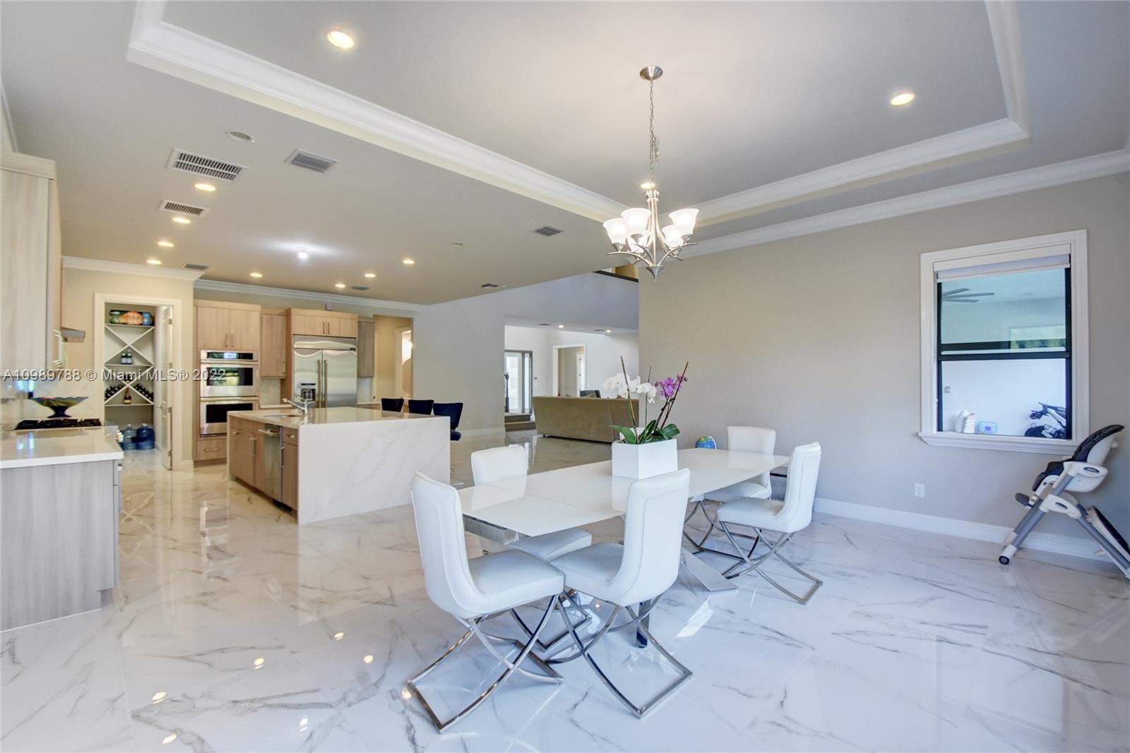17805 Rolling Oaks Estates Dr Ranches Southwest Ranches, FL 33331 - Photo 13 of 49 a living room with furniture and a chandelier