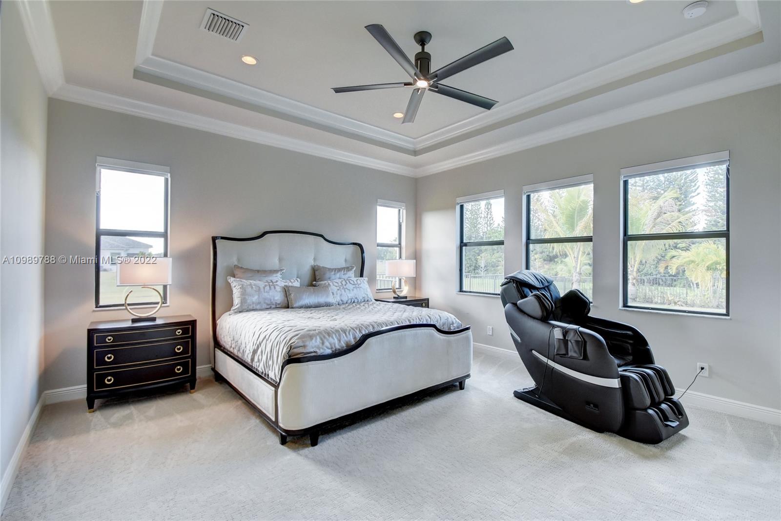 17805 Rolling Oaks Estates Dr Ranches Southwest Ranches, FL 33331 - Photo 17 of 49 a spacious bedroom with a bed a couch and a window