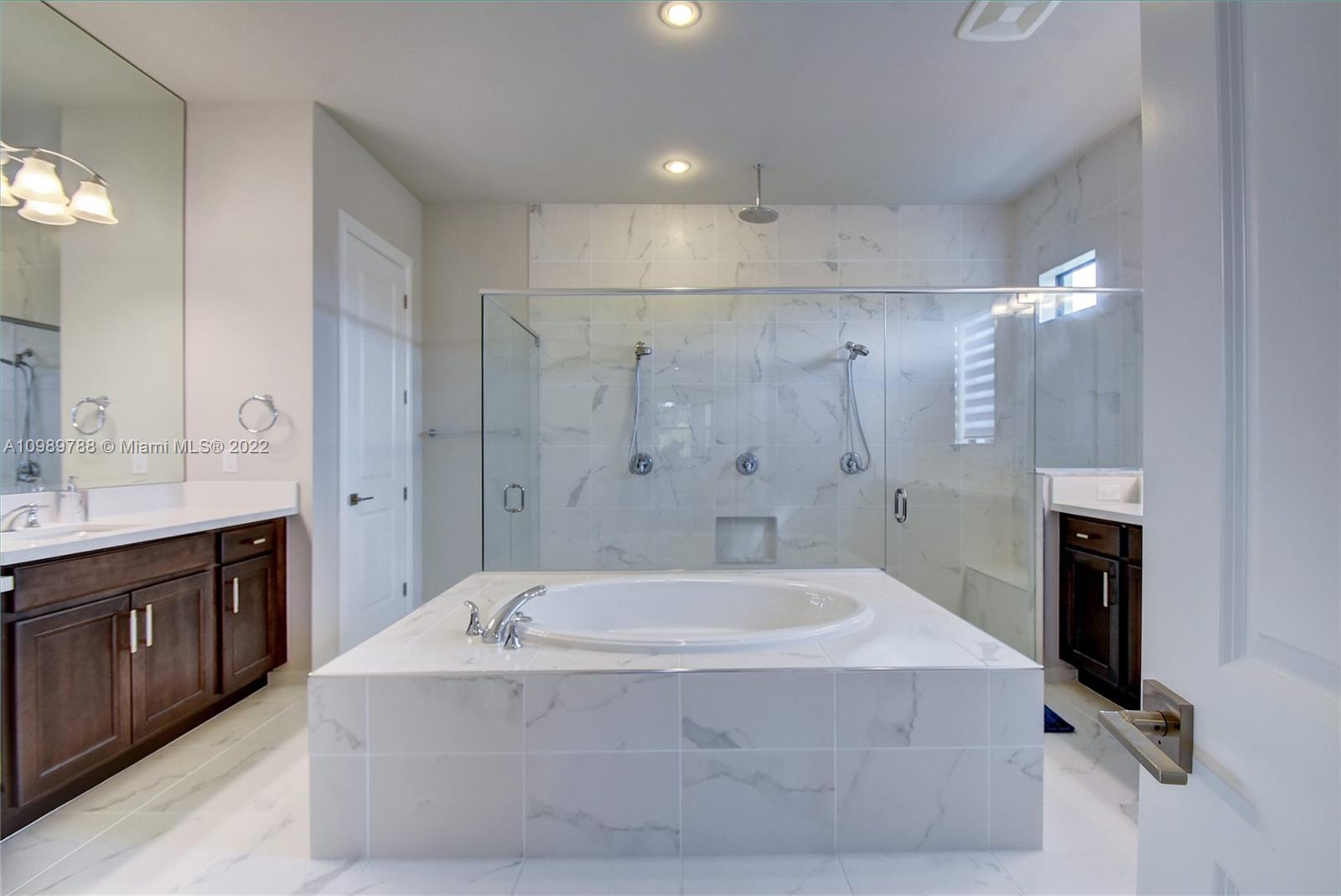 17805 Rolling Oaks Estates Dr Ranches Southwest Ranches, FL 33331 - Photo 19 of 49 a spacious bathroom with sink mirror and shower