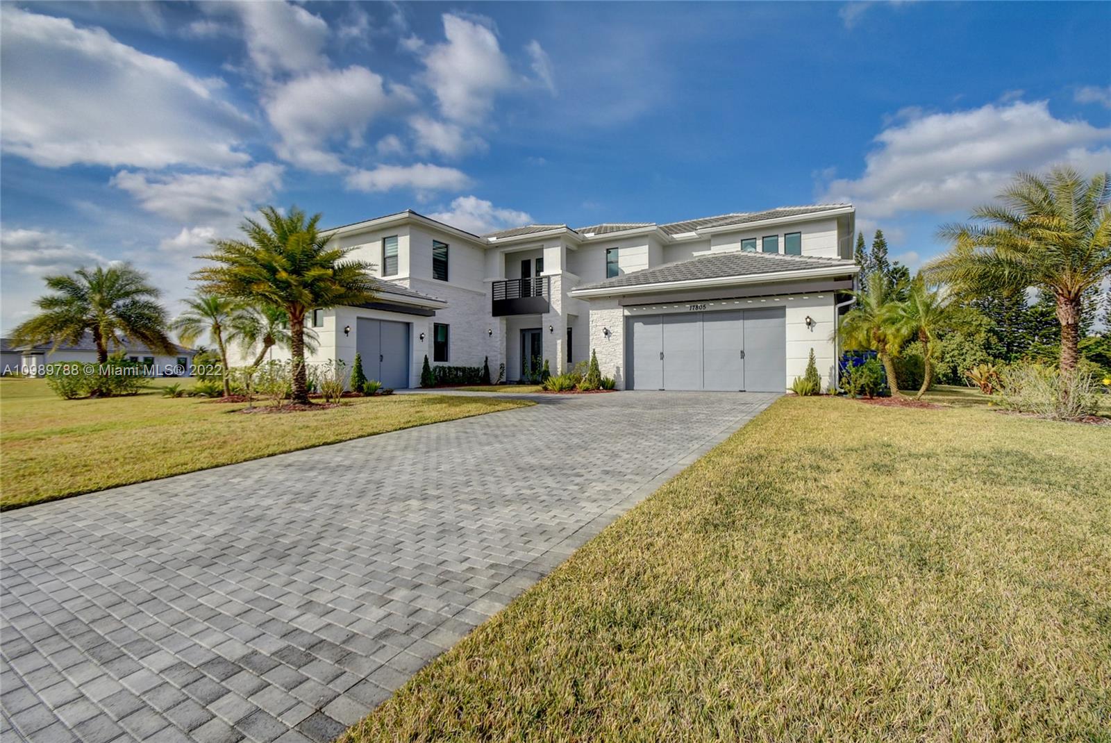 17805 Rolling Oaks Estates Dr Ranches Southwest Ranches, FL 33331 - Photo 2 of 49 a front view of a house with a yard