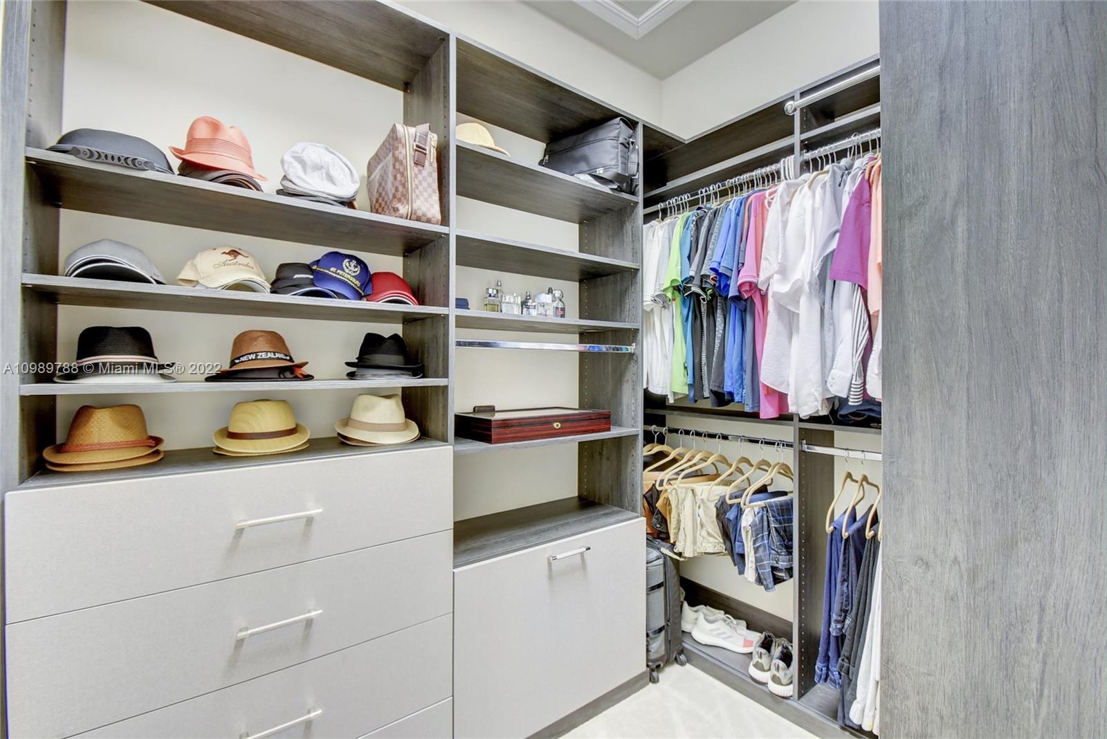 17805 Rolling Oaks Estates Dr Ranches Southwest Ranches, FL 33331 - Photo 21 of 49 a view of walk in closet with clothes and shoes