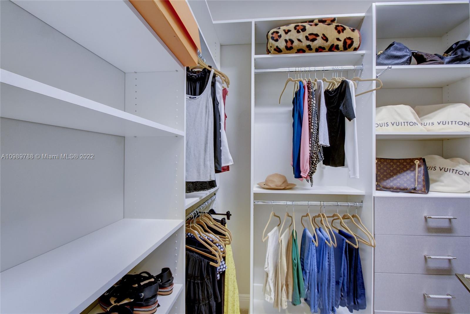 17805 Rolling Oaks Estates Dr Ranches Southwest Ranches, FL 33331 - Photo 22 of 49 a view of walk in closet with clothes and shoes