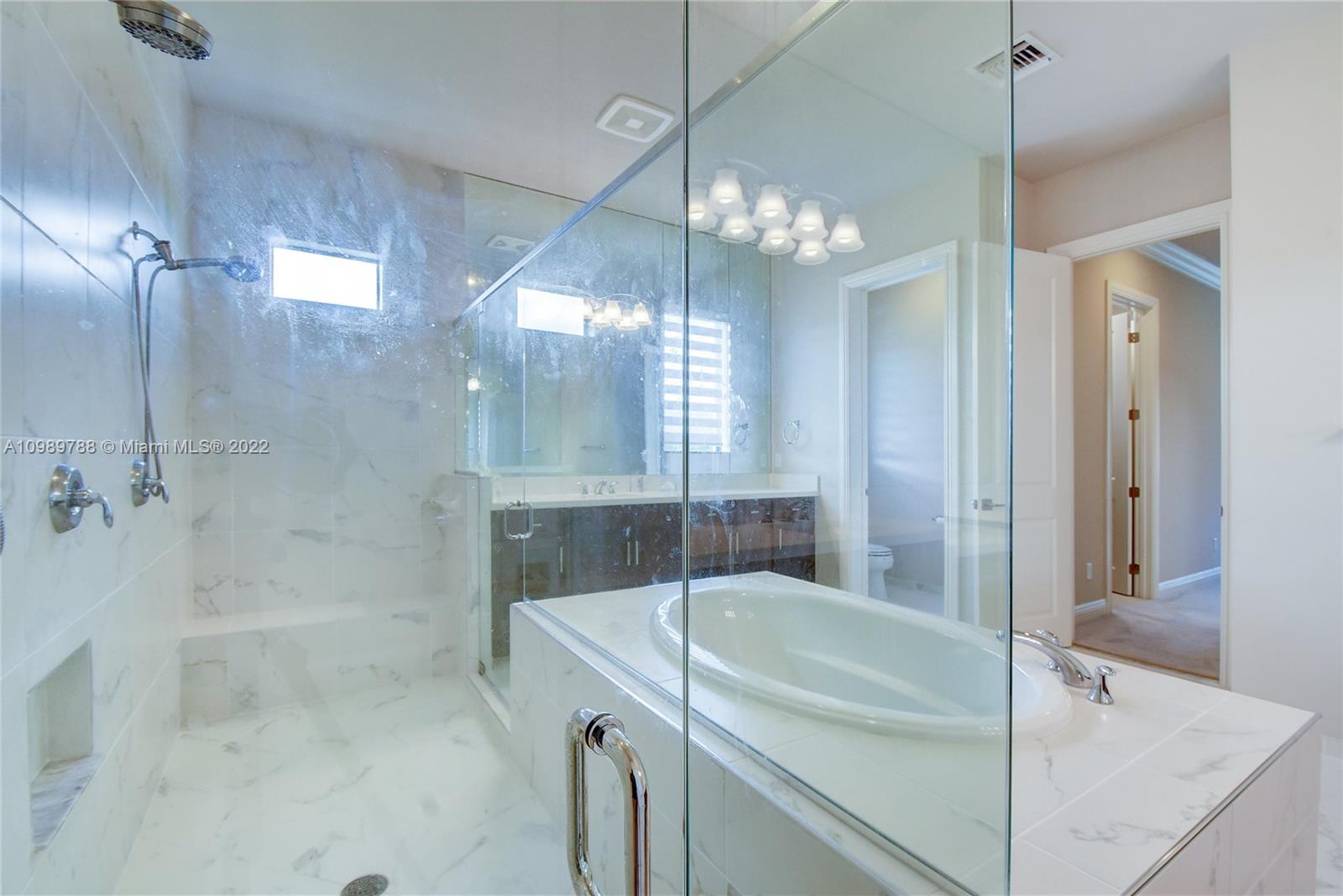 17805 Rolling Oaks Estates Dr Ranches Southwest Ranches, FL 33331 - Photo 23 of 49 a bathroom with a tub shower and sink