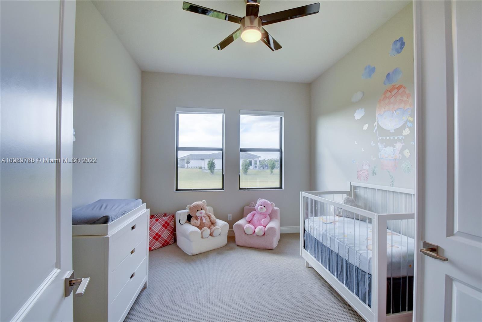 17805 Rolling Oaks Estates Dr Ranches Southwest Ranches, FL 33331 - Photo 24 of 49 a bedroom with a bed and a window