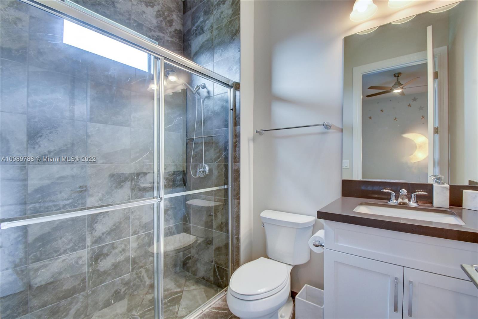 17805 Rolling Oaks Estates Dr Ranches Southwest Ranches, FL 33331 - Photo 25 of 49 a bathroom with a toilet a sink and shower