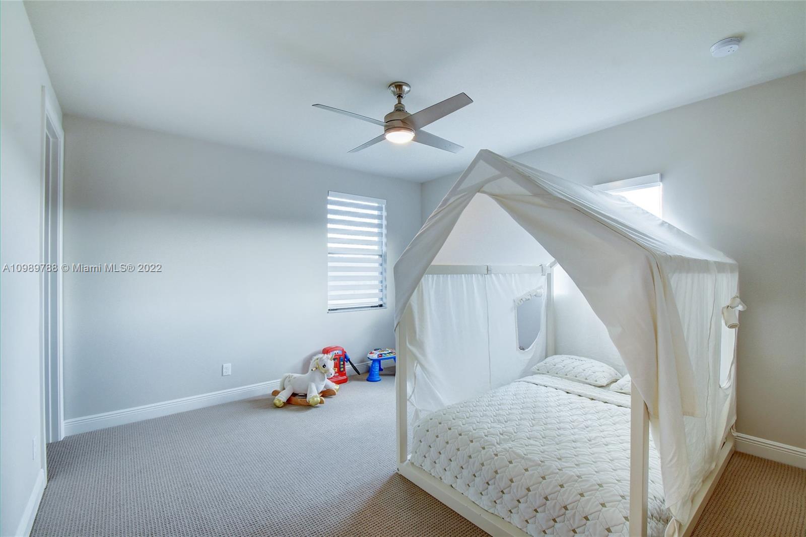 17805 Rolling Oaks Estates Dr Ranches Southwest Ranches, FL 33331 - Photo 31 of 49 wooden floor & ceiling fan in a room