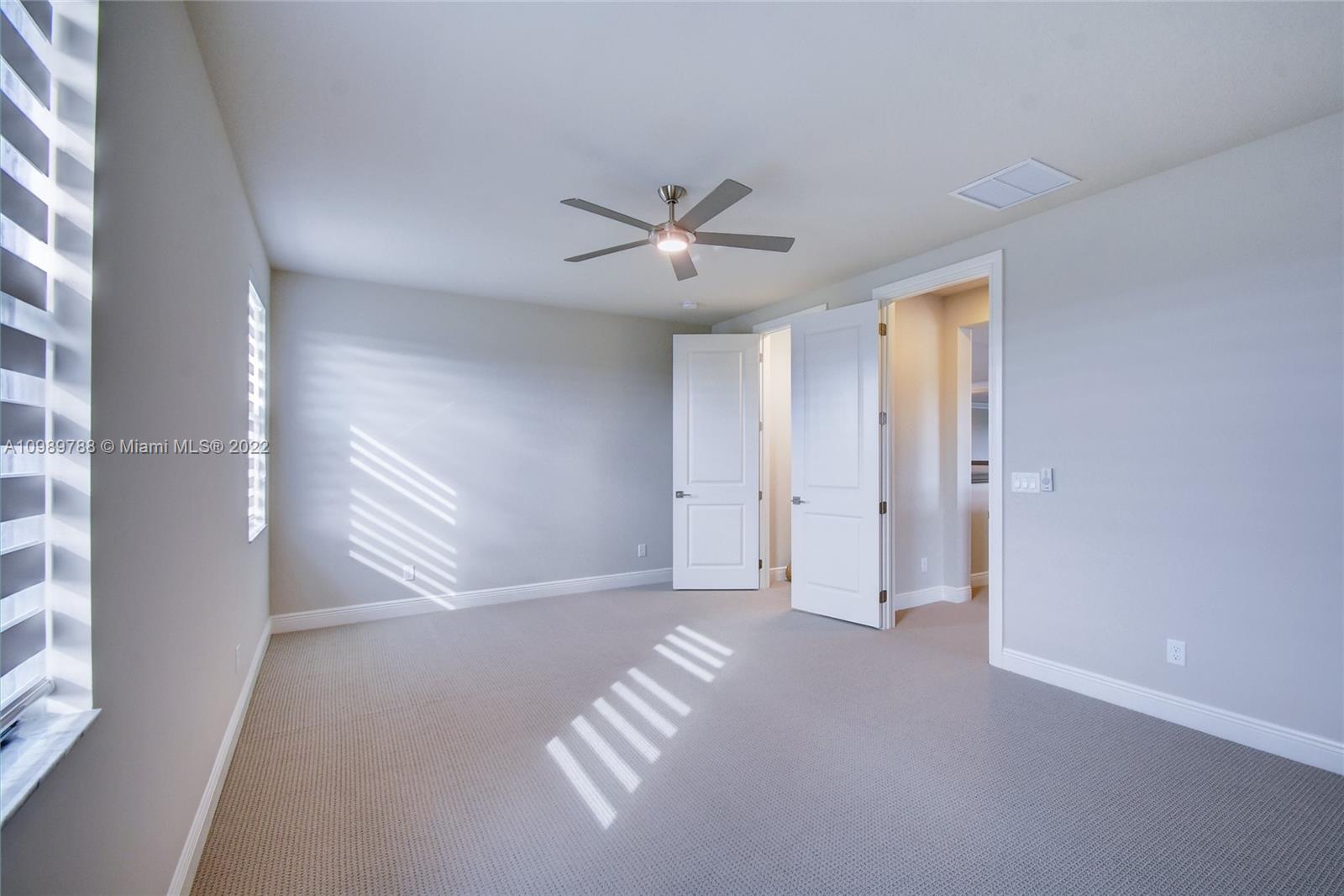 17805 Rolling Oaks Estates Dr Ranches Southwest Ranches, FL 33331 - Photo 34 of 49 a view of n empty room with a ceiling fan and window