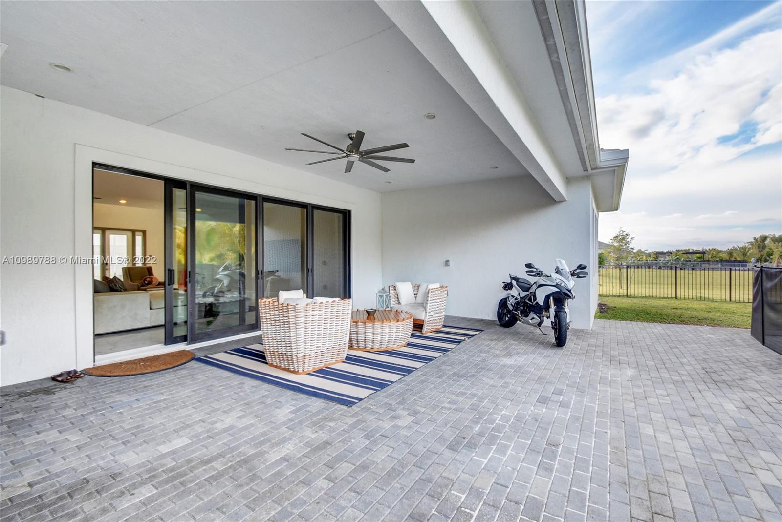 17805 Rolling Oaks Estates Dr Ranches Southwest Ranches, FL 33331 - Photo 39 of 49 a view of a room with gym equipment and floor to ceiling window
