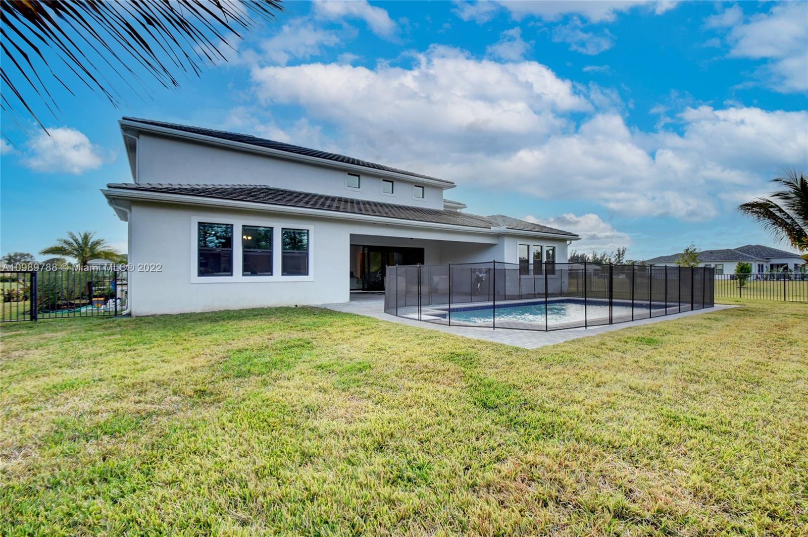 17805 Rolling Oaks Estates Dr Ranches Southwest Ranches, FL 33331 - Photo 40 of 49 a swimming pool with outdoor seating and yard