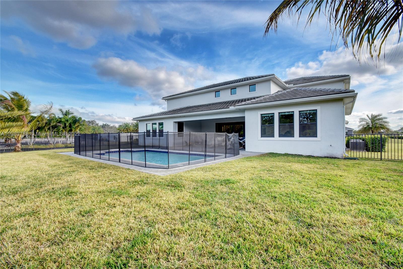 17805 Rolling Oaks Estates Dr Ranches Southwest Ranches, FL 33331 - Photo 41 of 49 a view of a house with swimming pool and sitting area