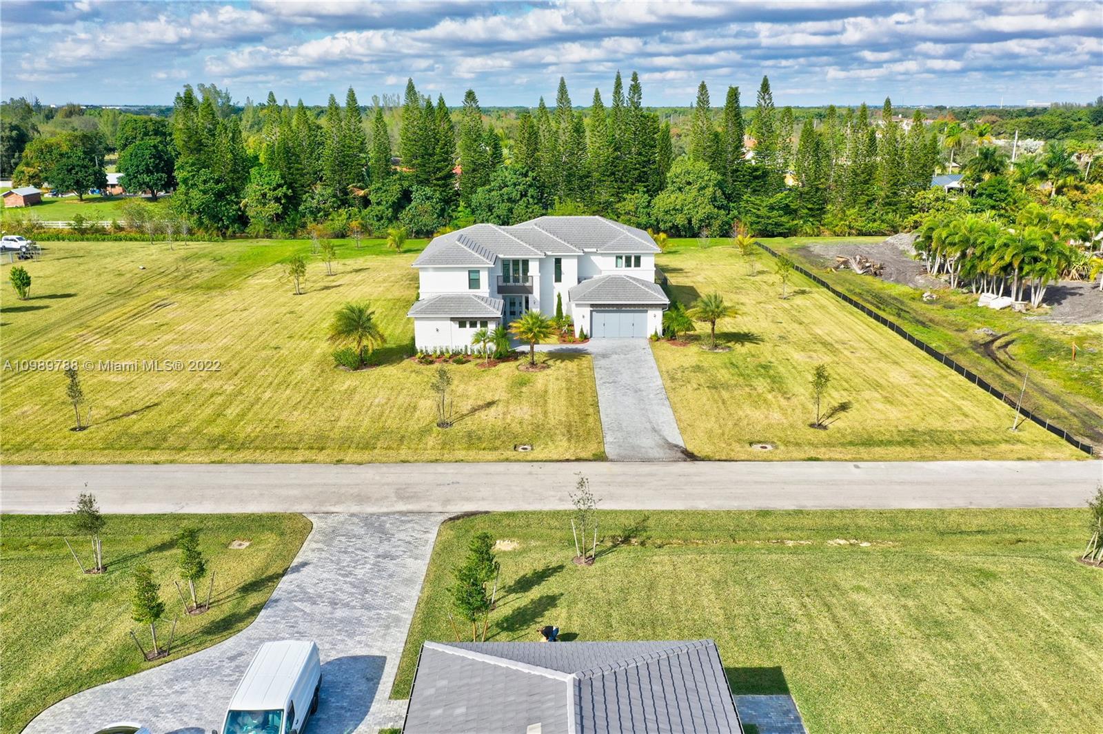 17805 Rolling Oaks Estates Dr Ranches Southwest Ranches, FL 33331 - Photo 44 of 49 a view of an outdoor space and swimming pool