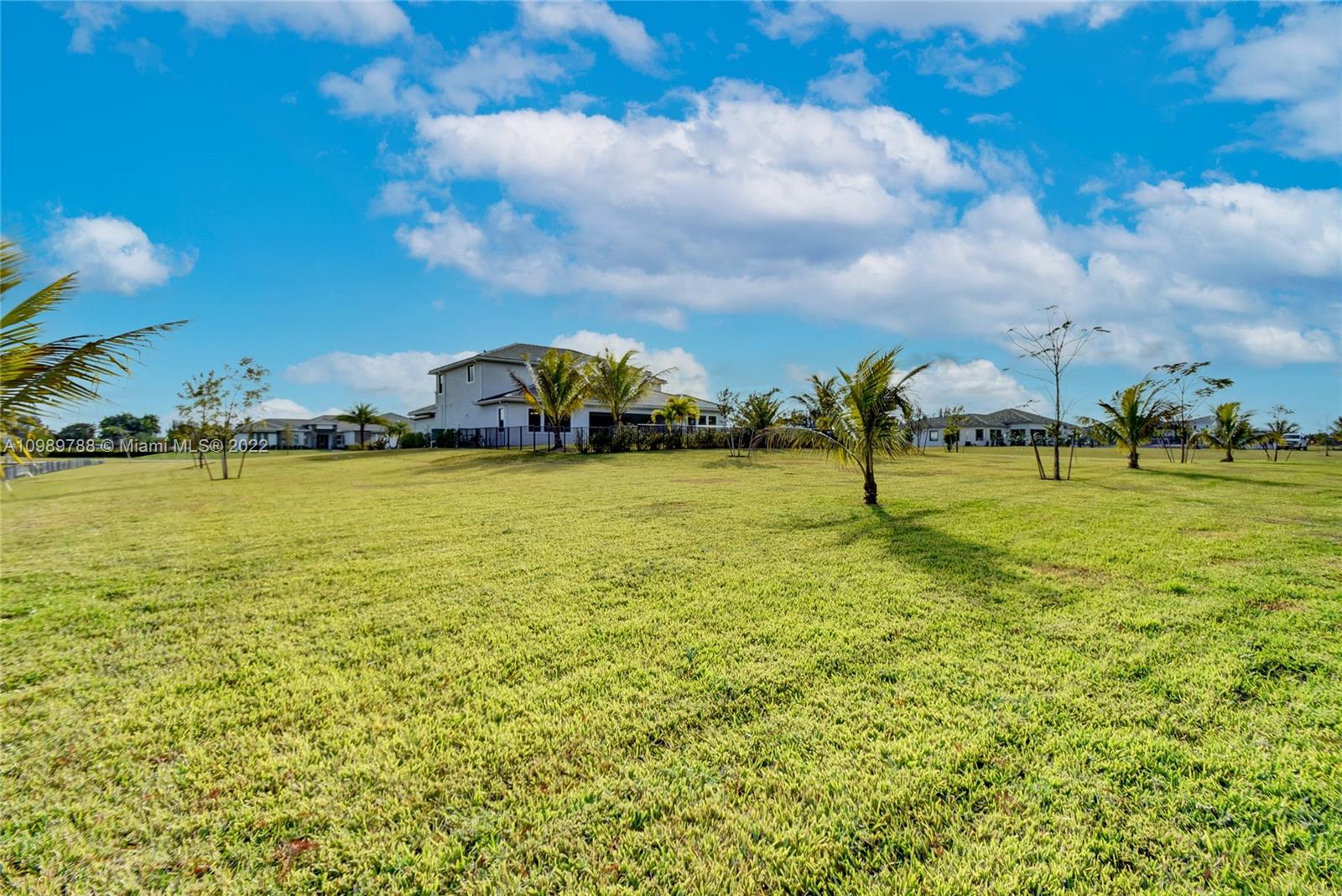 17805 Rolling Oaks Estates Dr Ranches Southwest Ranches, FL 33331 - Photo 45 of 49 a view of a pool with an outdoor seating and a yard