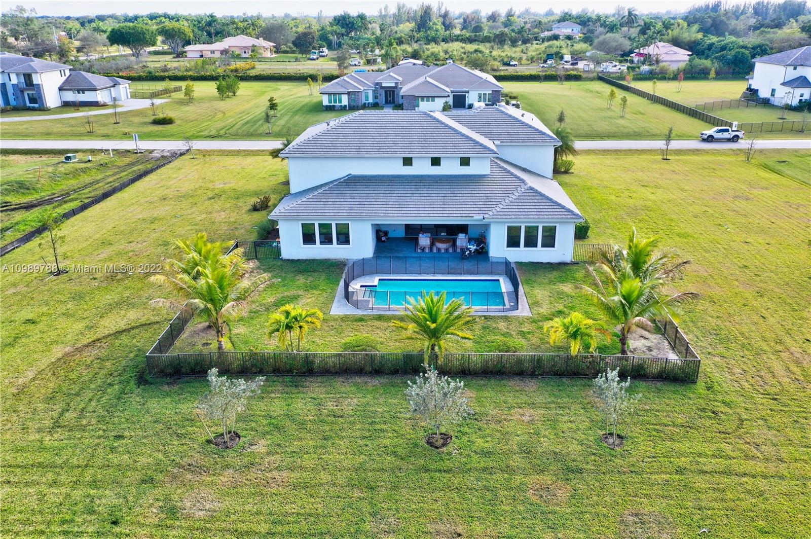 17805 Rolling Oaks Estates Dr Ranches Southwest Ranches, FL 33331 - Photo 49 of 49 an aerial view of a house with a ocean view