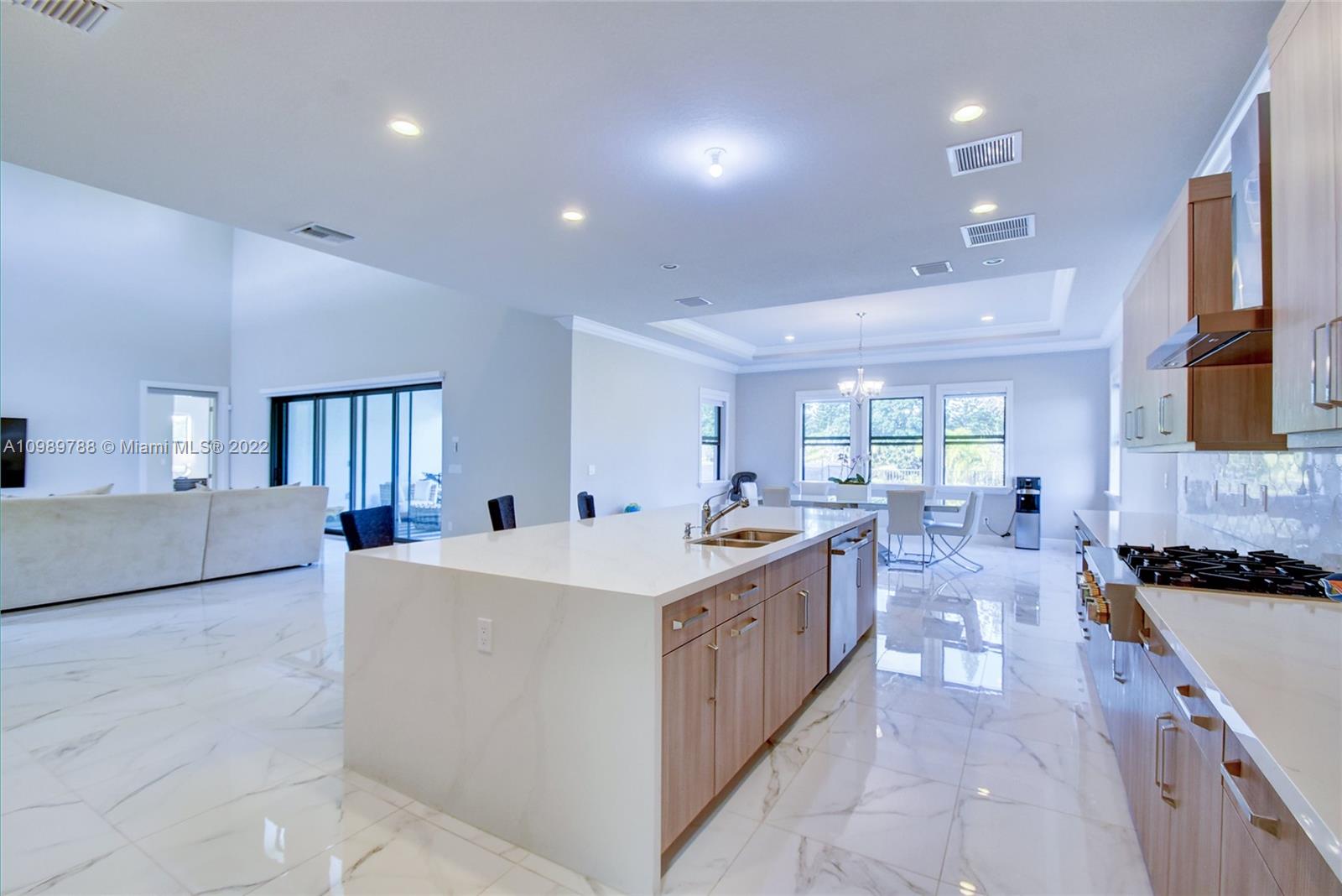 17805 Rolling Oaks Estates Dr Ranches Southwest Ranches, FL 33331 - Photo 10 of 49 a large white kitchen with a large window