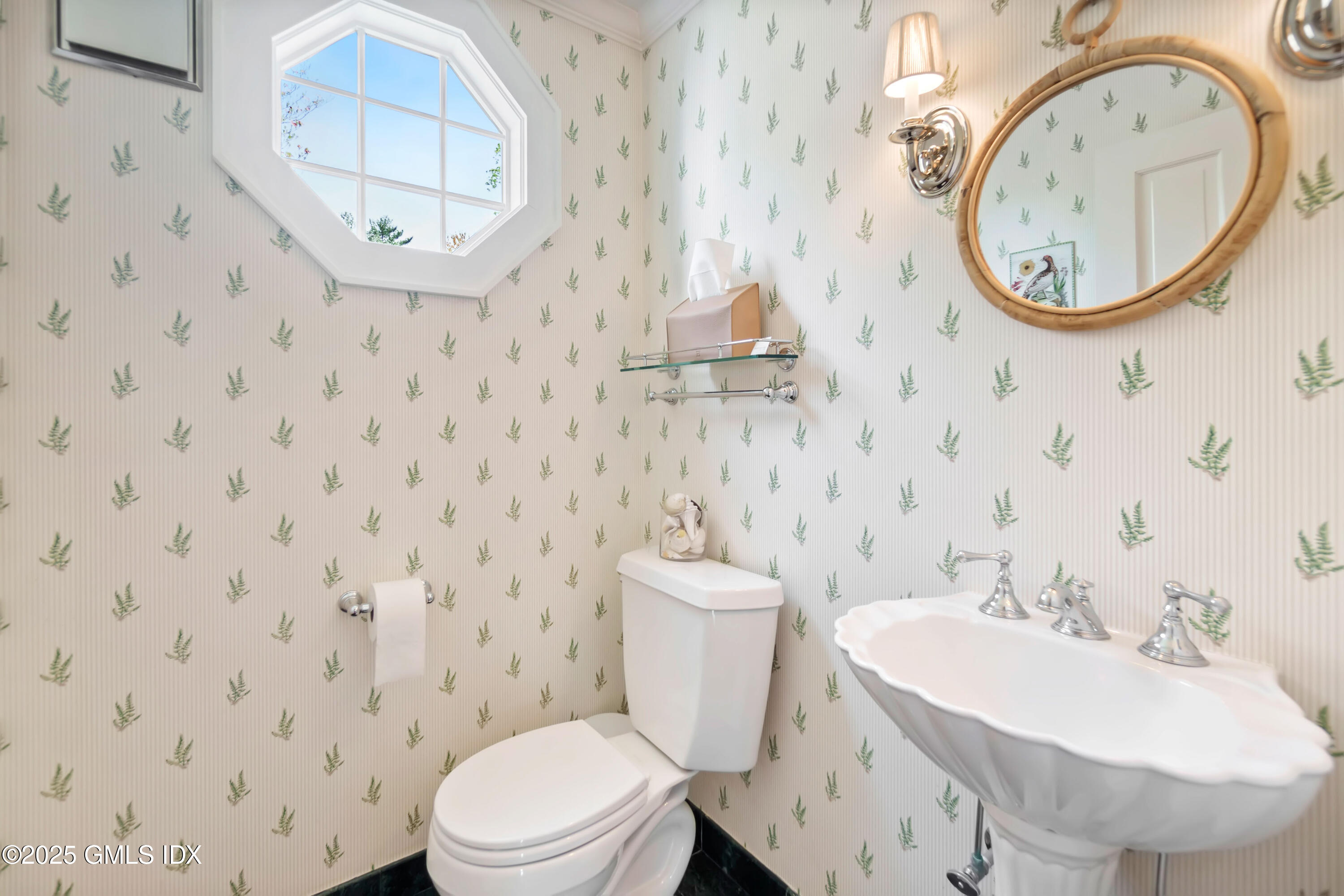 8 Woodside Road Greenwich, CT 06830 - Photo 3 of 10 a bathroom with a sink a mirror and a toilet