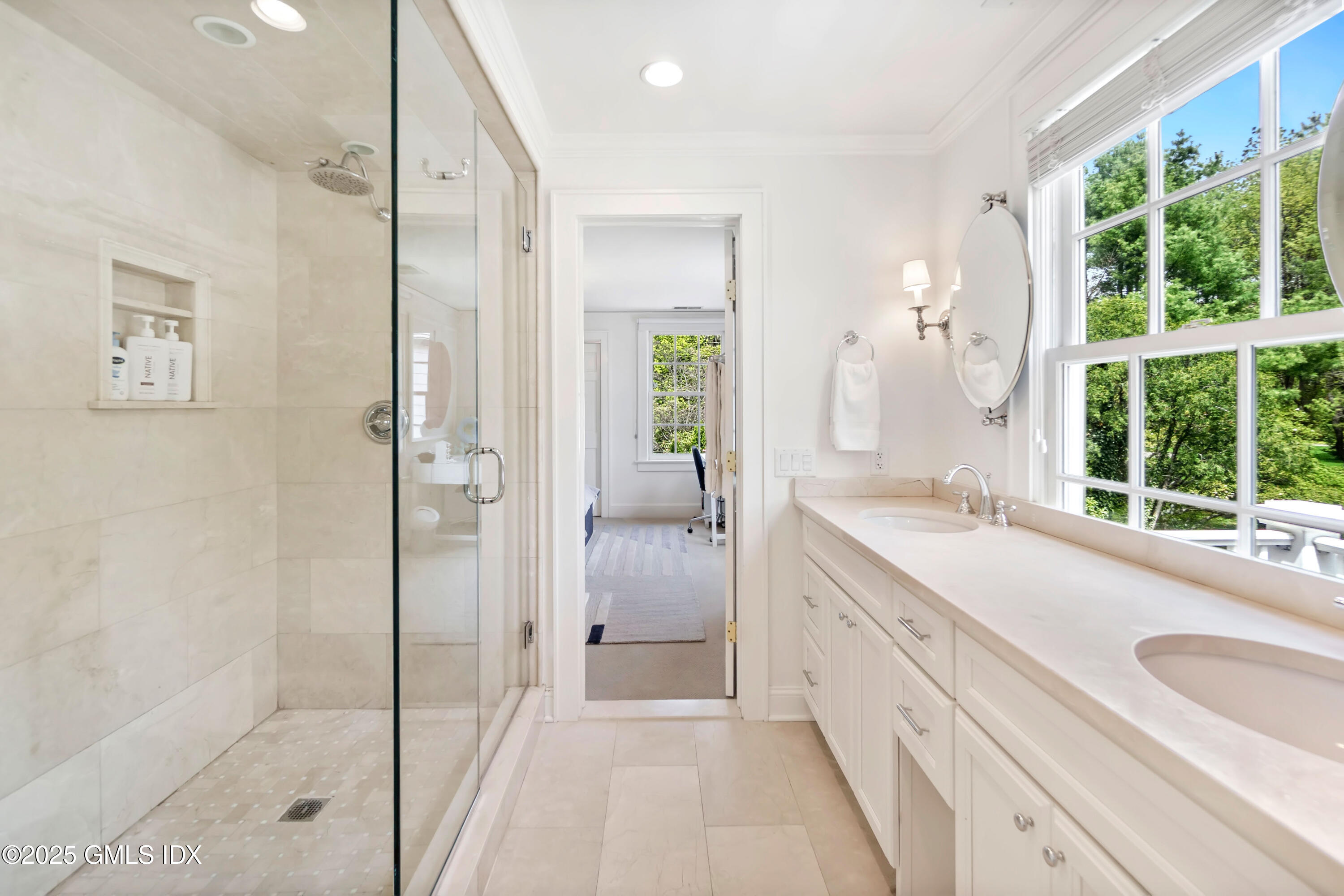 8 Woodside Road Greenwich, CT 06830 - Photo 8 of 10 a spacious bathroom with a granite countertop sink mirror and a bathtub