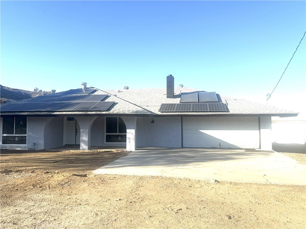 21145-21145 Kimes Lane Perris, CA 92570 - Photo 1 of 8 a view of a house with a outdoor space