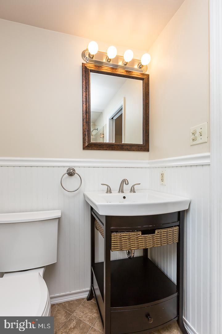 339 East Spring Avenue Ardmore, PA 19003 - Photo 26 of 44 a bathroom with a toilet sink and mirror