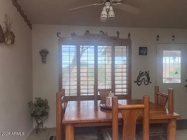 a view of a dining room with furniture and window