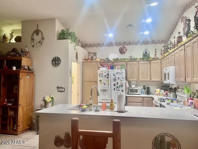 a kitchen with stainless steel appliances granite countertop a stove and cabinets