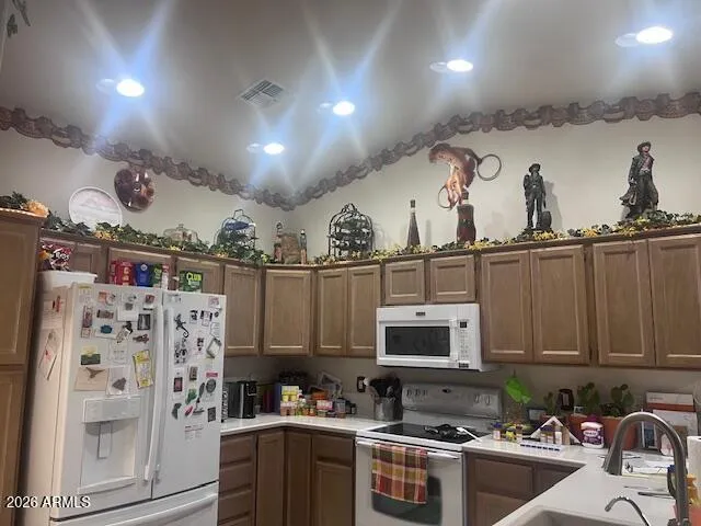 a kitchen with a sink a stove and cabinets