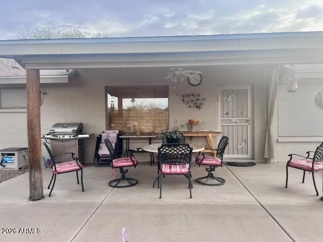 a living room with furniture and a book shelf