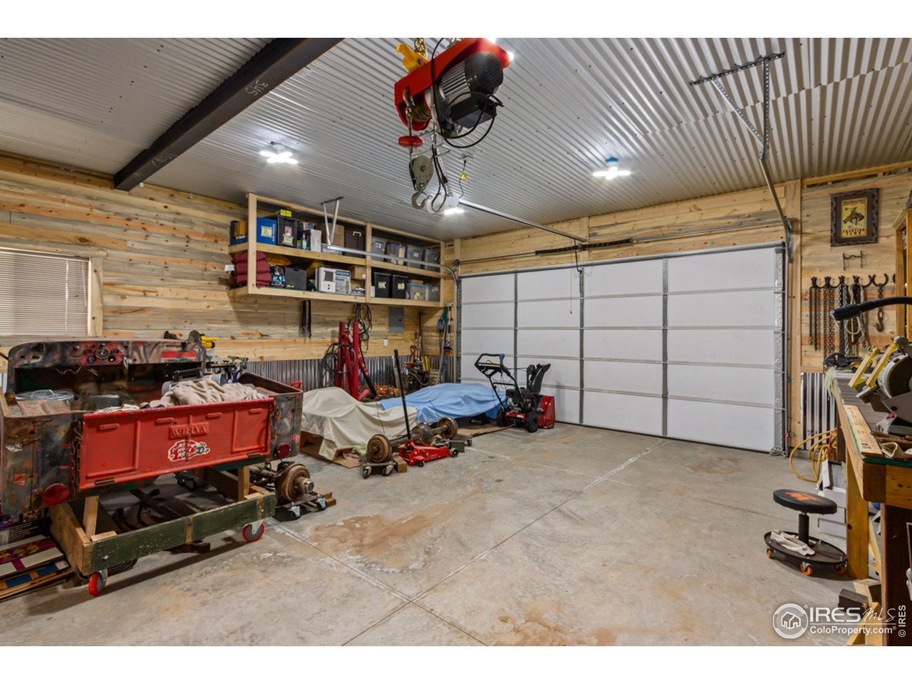 345 Caddo Road Red Feather Lakes, CO 80545 - Photo 25 of 40 2 car garage/shop, finished with beetle kill pine, corrugated ceiling and wainscot!