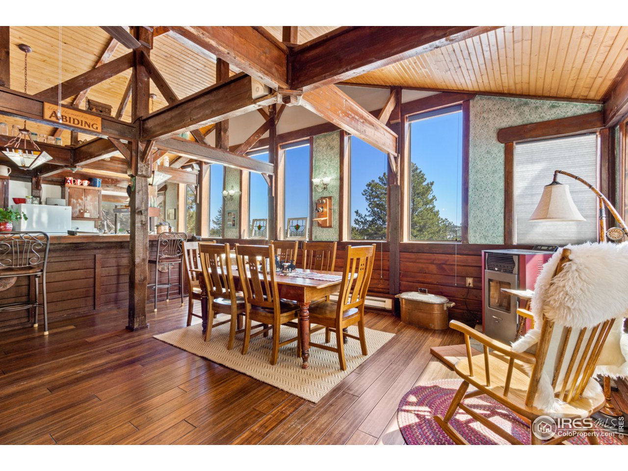 345 Caddo Road Red Feather Lakes, CO 80545 - Photo 40 of 40 Open floor plan, spacious dining area, pellet stove in the corner