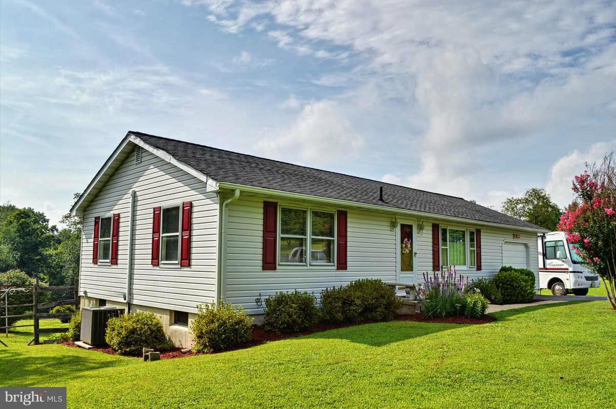 4948 Roller Road Manchester, MD 21102 - Photo 1 of 21 a view of a house with backyard and garden