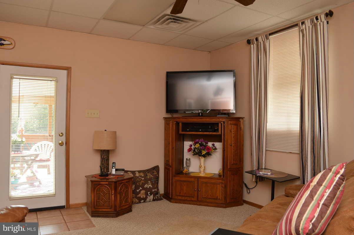 4948 Roller Road Manchester, MD 21102 - Photo 12 of 21 a living room with furniture and a flat screen tv