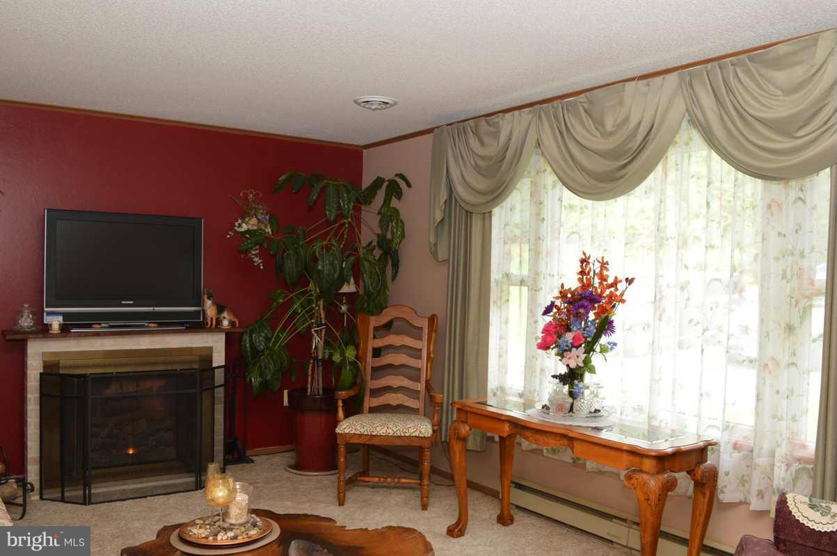 4948 Roller Road Manchester, MD 21102 - Photo 9 of 21 a living room with furniture and a flat screen tv