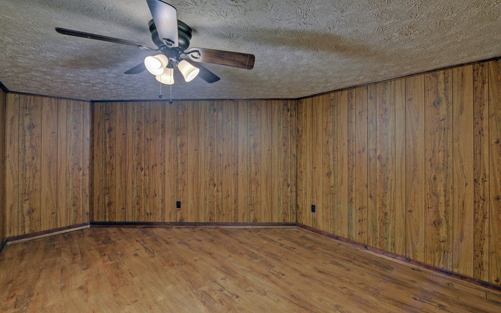 15 Trails End Road Blue Ridge, GA 30513 - Photo 21 of 46 wooden floor in an empty room with a window