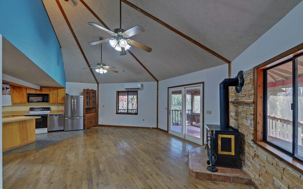 15 Trails End Road Blue Ridge, GA 30513 - Photo 8 of 46 a living room with stainless steel appliances furniture a fireplace and a flat screen tv